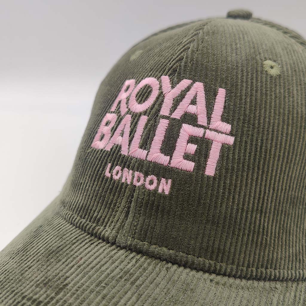 Green cap with &#39;Royal Ballet London&#39; text on a white background