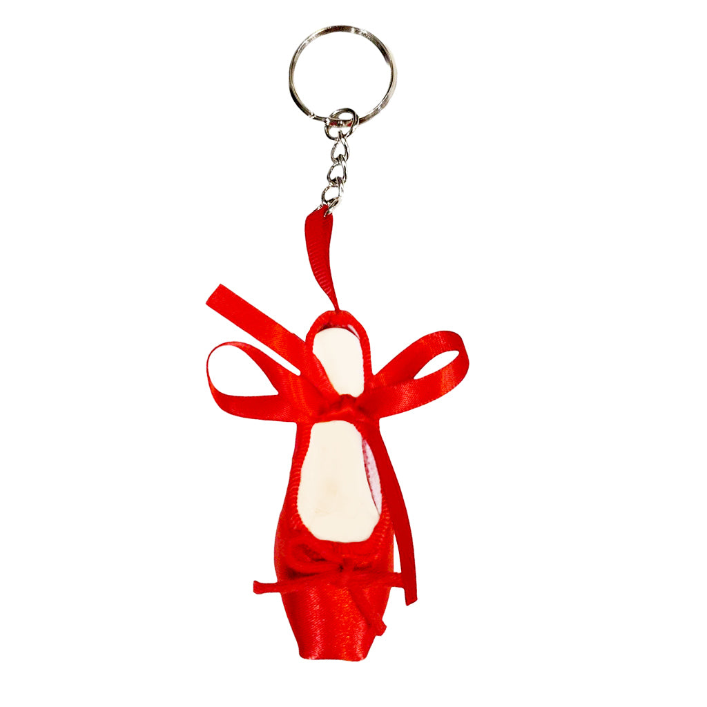 red satin ballet shoe keyring on a white background