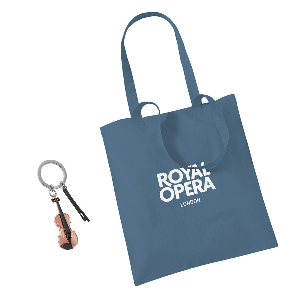 Violin with bow keyring next to a blue Royal Opera London Tote bag on a white background