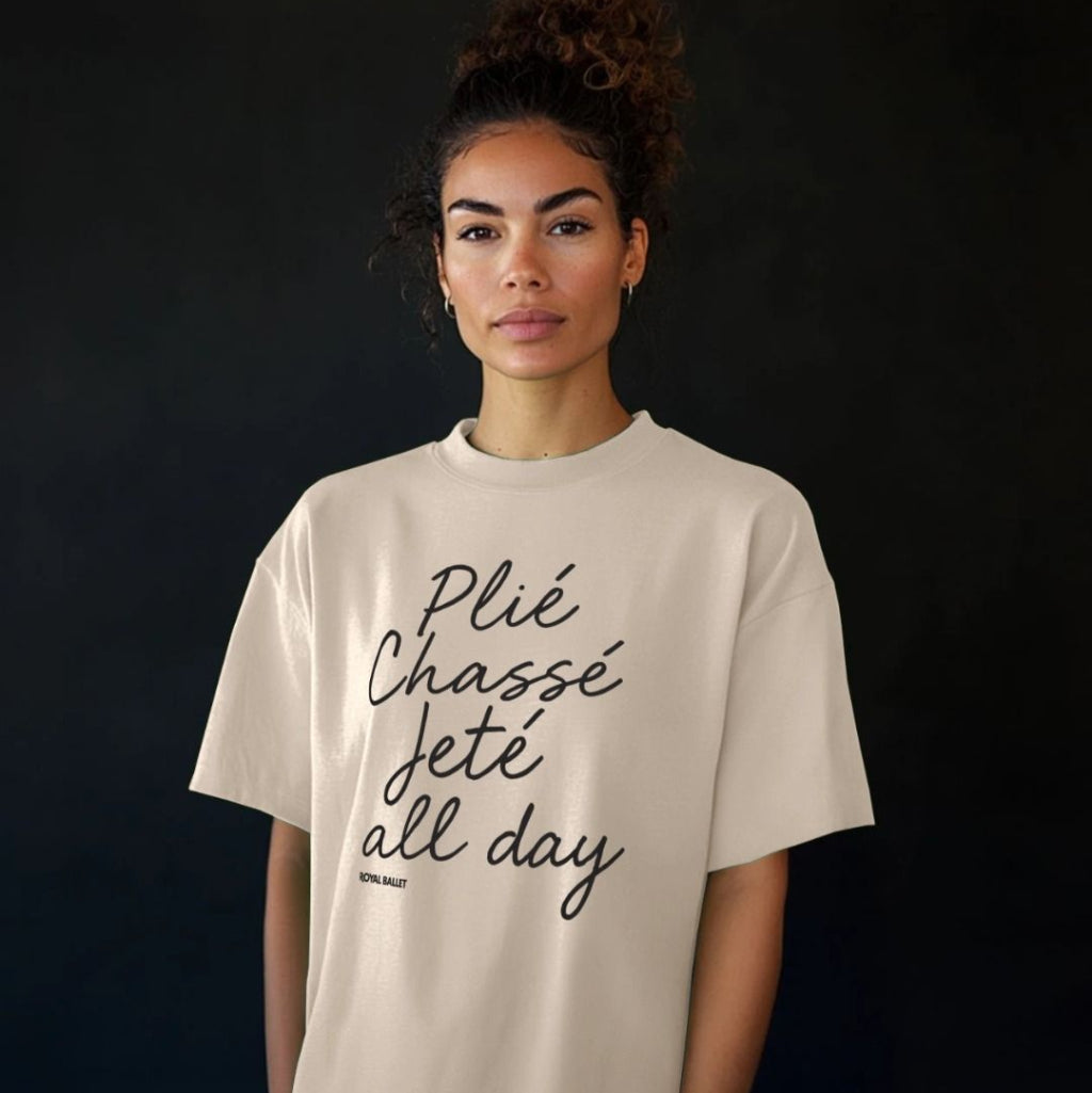 Oat Printed T-shirt with text in black handwriting plié chassé jeté all day on a white background