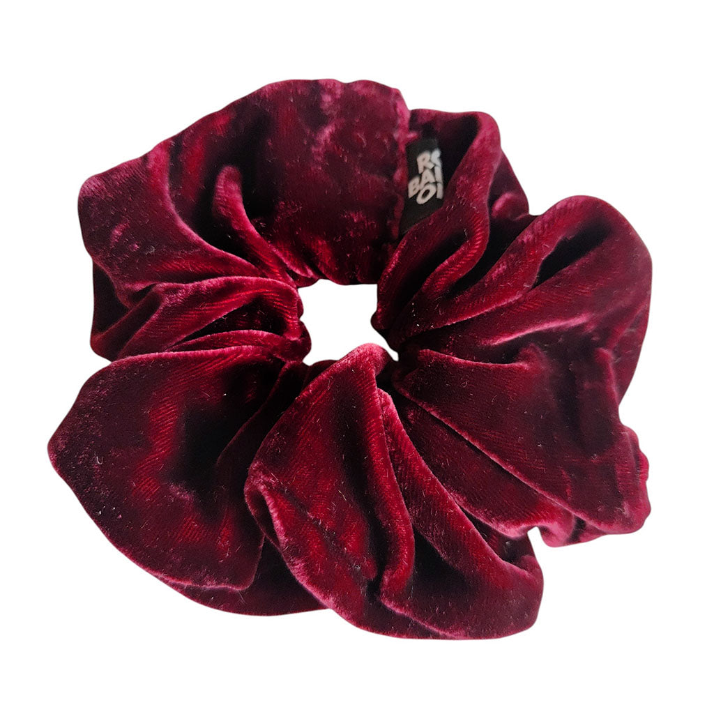 Red velvet scrunchie on a white background