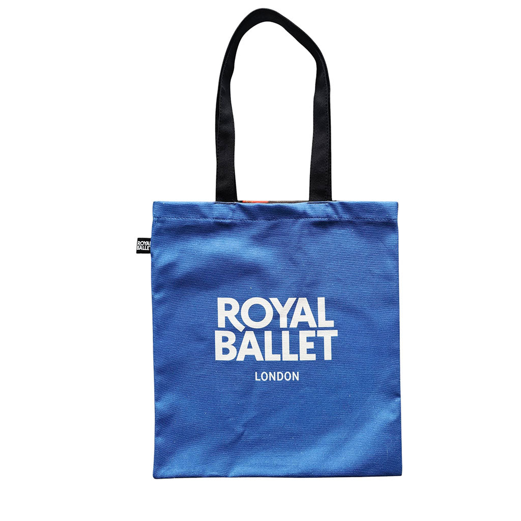 Back of the colourful ballet shoes tote blue with 'Royal Ballet London' text on a white background