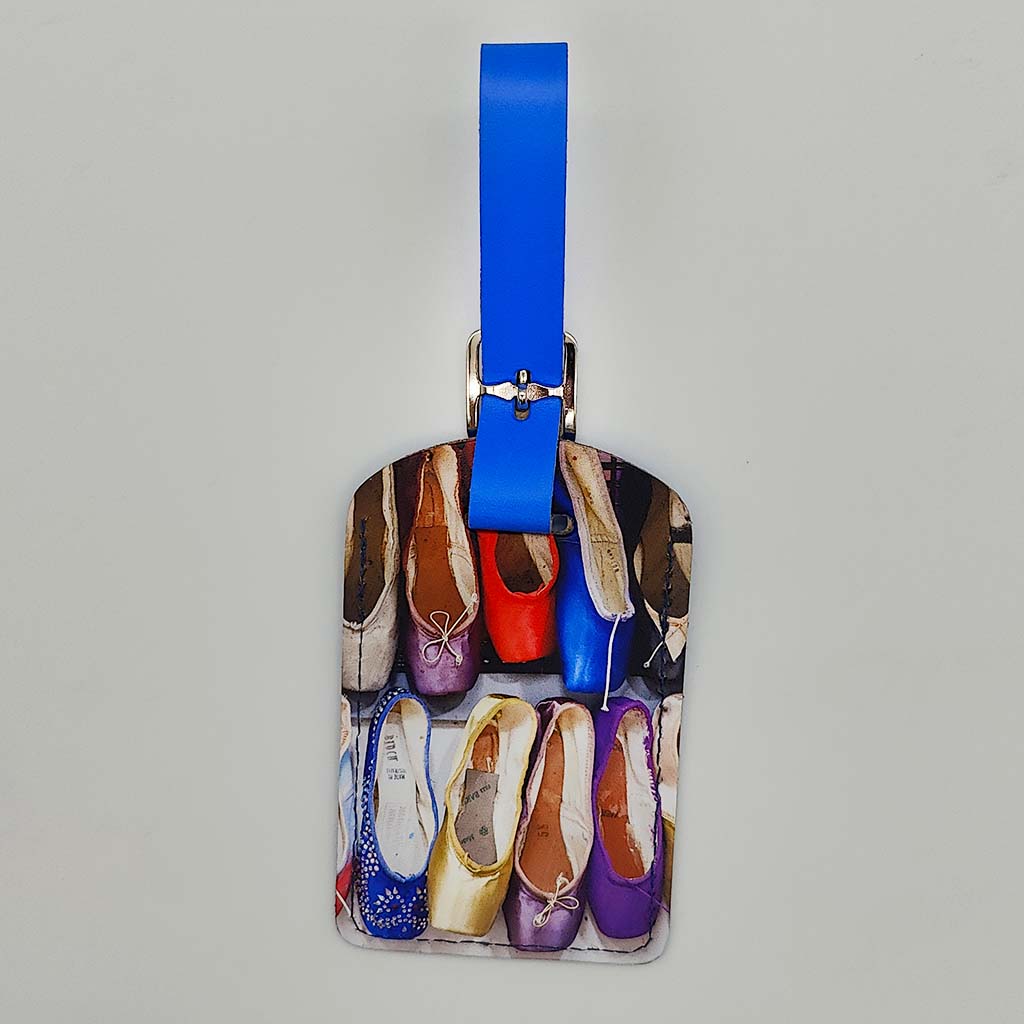 Luggage tag with colourful ballet shoes design on a gray background