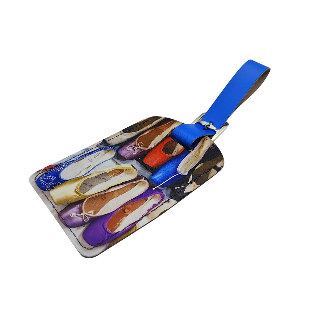 Luggage tag with colourful ballet shoe design on a white background