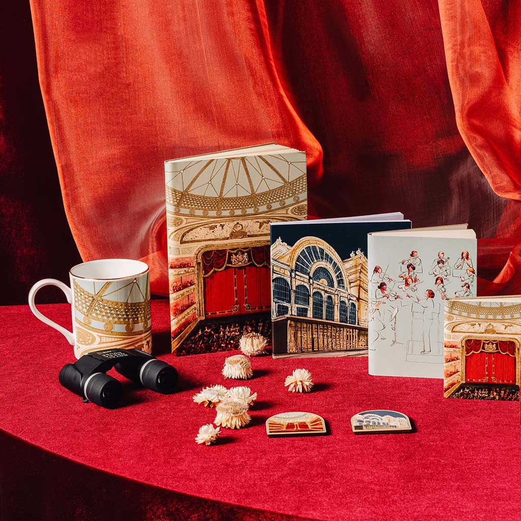 rbo collection, mugs, opera glasses and notebooks on red velvet