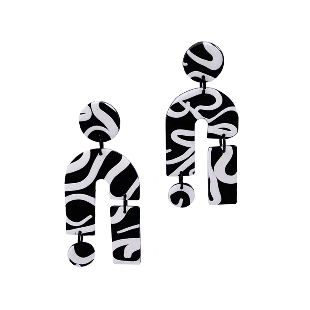 A pair of modern statement earrings with a black and white abstract wavy pattern, displayed against a solid white background.