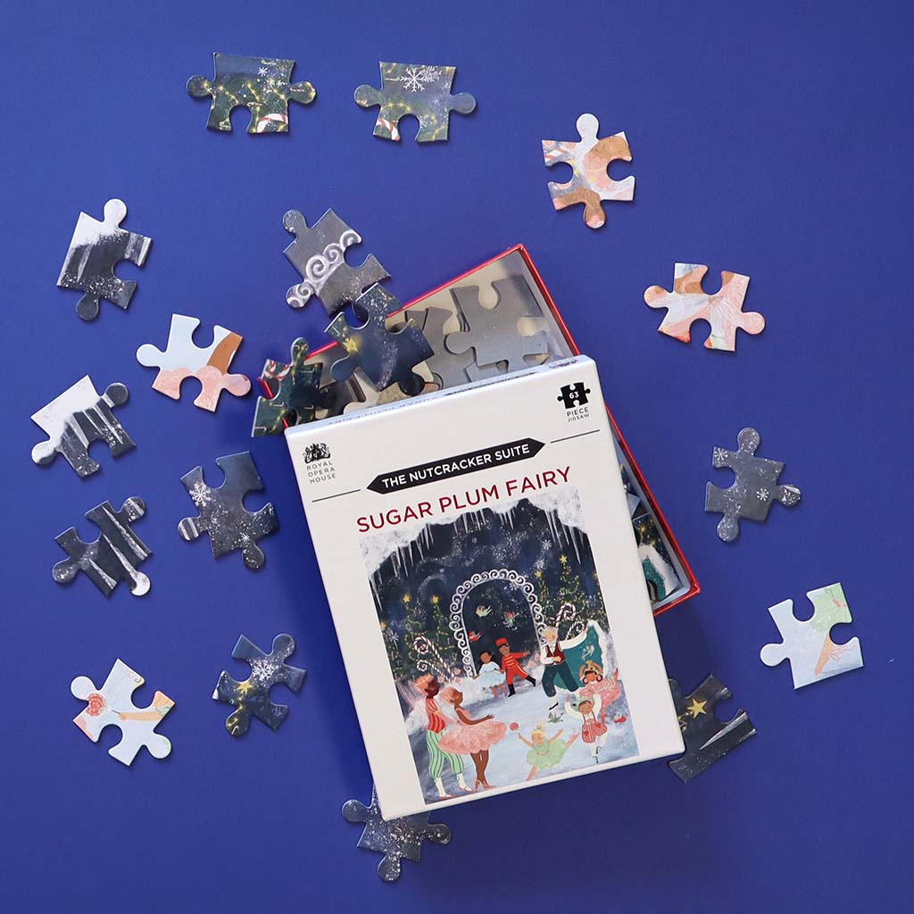 Jigsaw puzzle set with &#39;The Nutcracker Suite&#39; theme on a blue background
