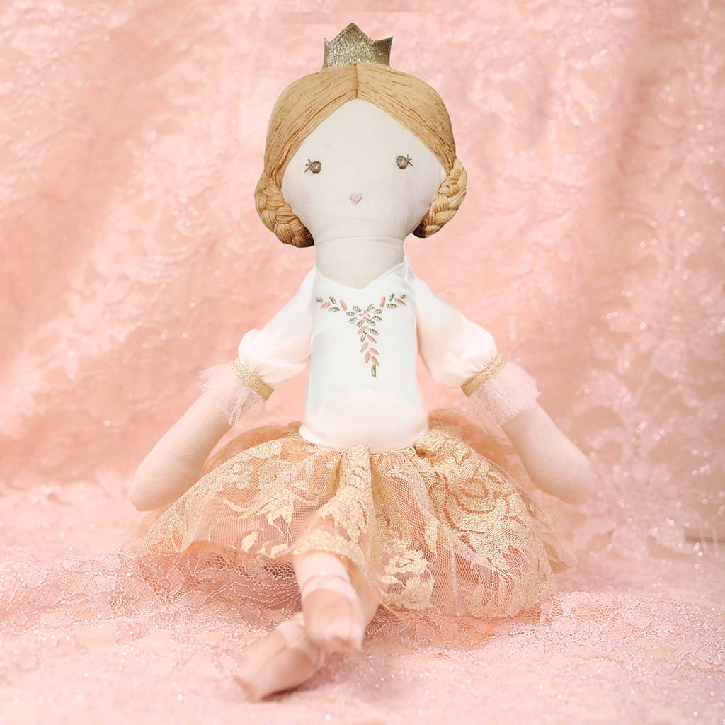 Sugar Plum Fairy Doll with a white dress and lace skirt on a white background