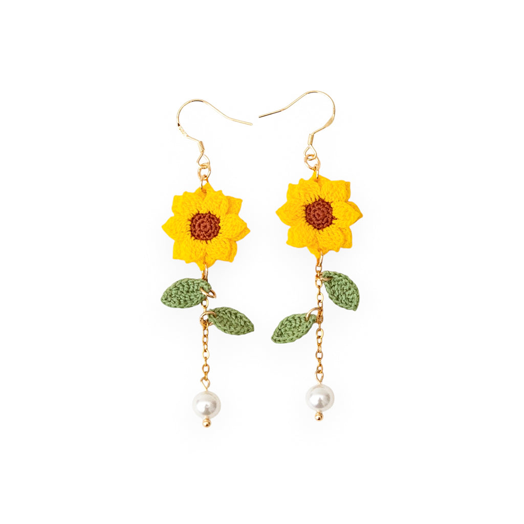 micro crochet sunflower drop earrings with pearls on a white background
