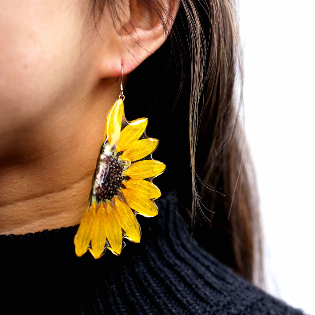 Sunflower earrings on a white background