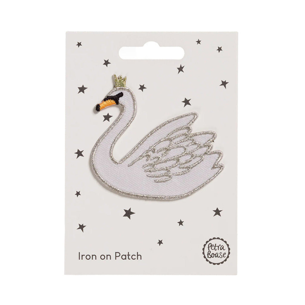 embroidered Iron on Swan patch on white card with stars on a white background