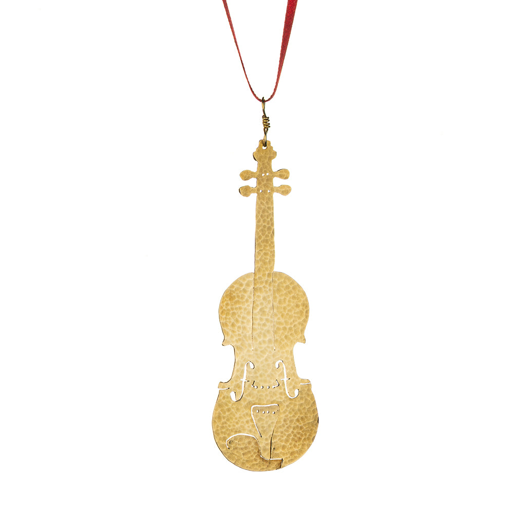 textured brass violin hanging on a red ribbon on a white background
