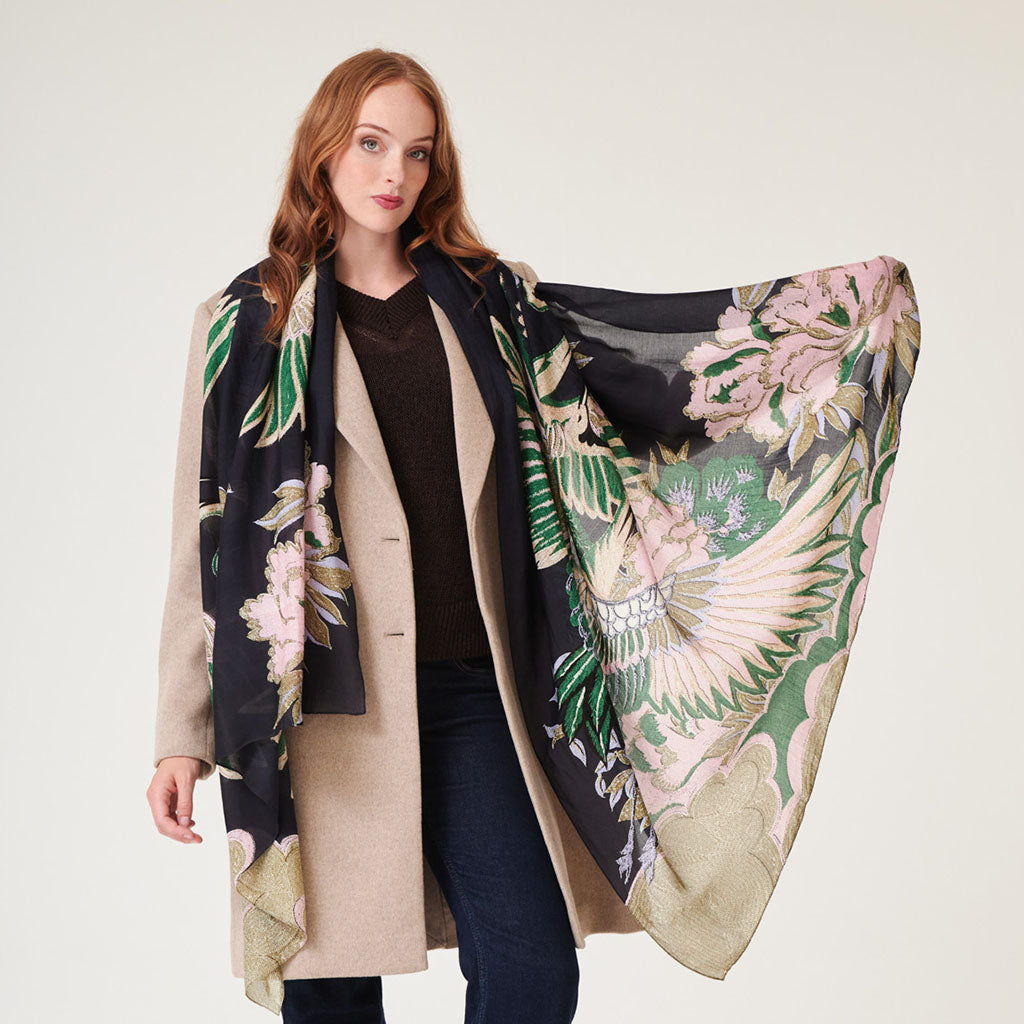 Black, pink and sand Crane patterned scarf  on a white background