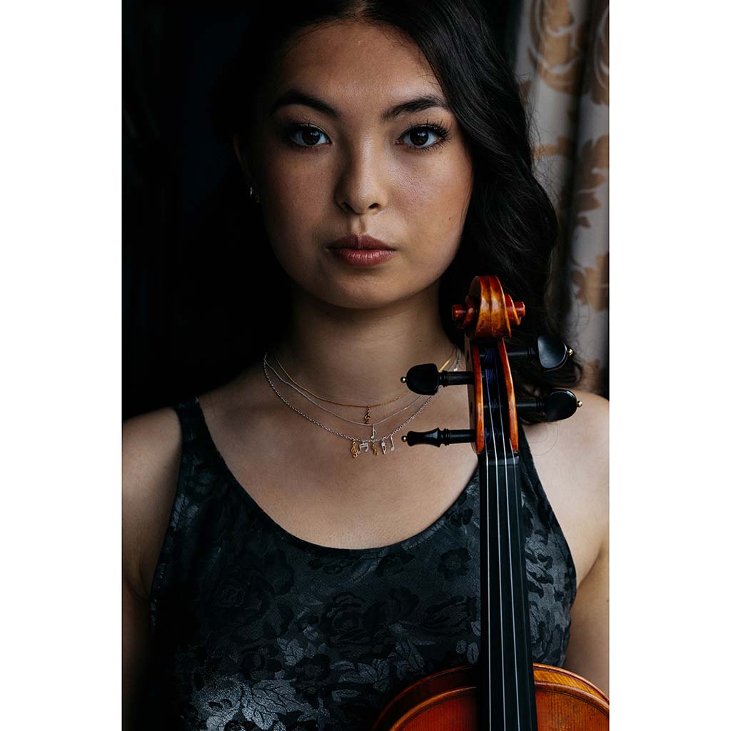 music note necklaces on violinist