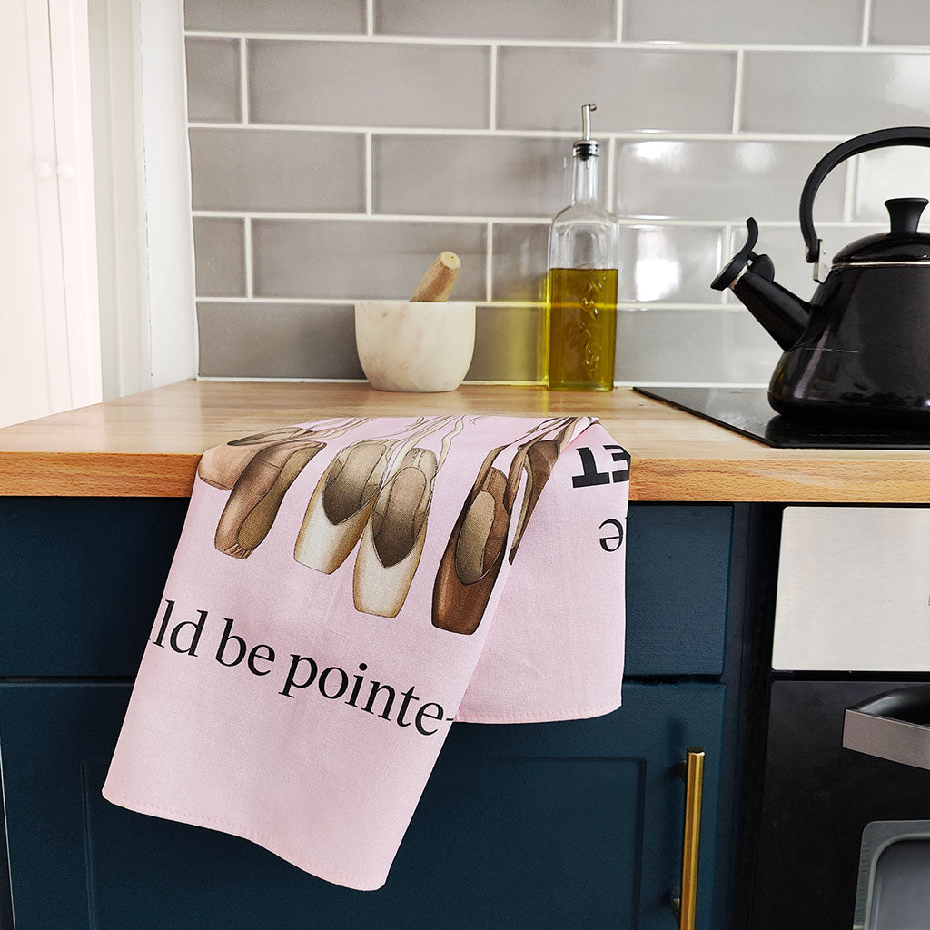 Pink ballet tea towel on a kitchen counter