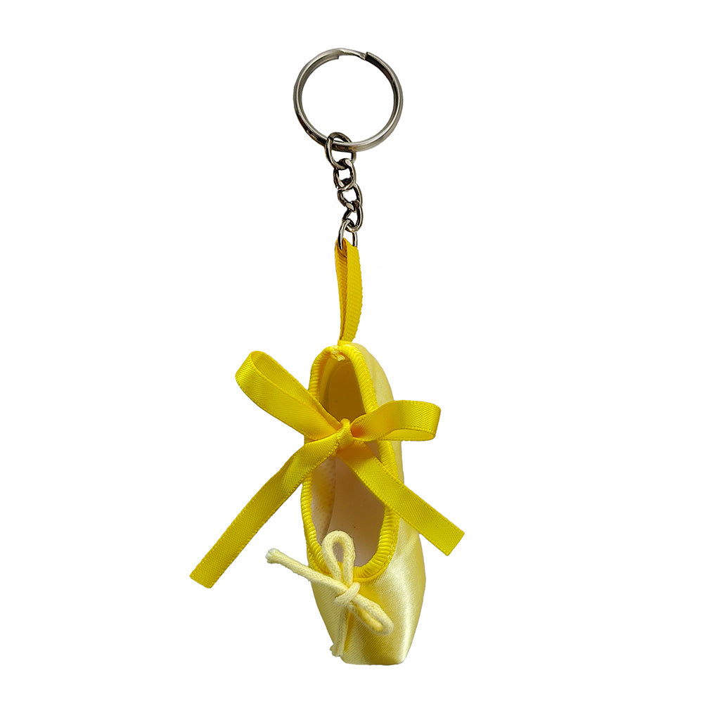 yellow ballet shoe keyring on a white background