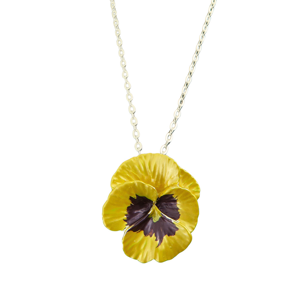 Yellow pansy flower pendant on a chain against a white background