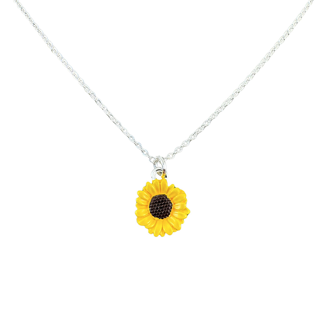 Yellow sunflower pendant on a silver chain against a white background