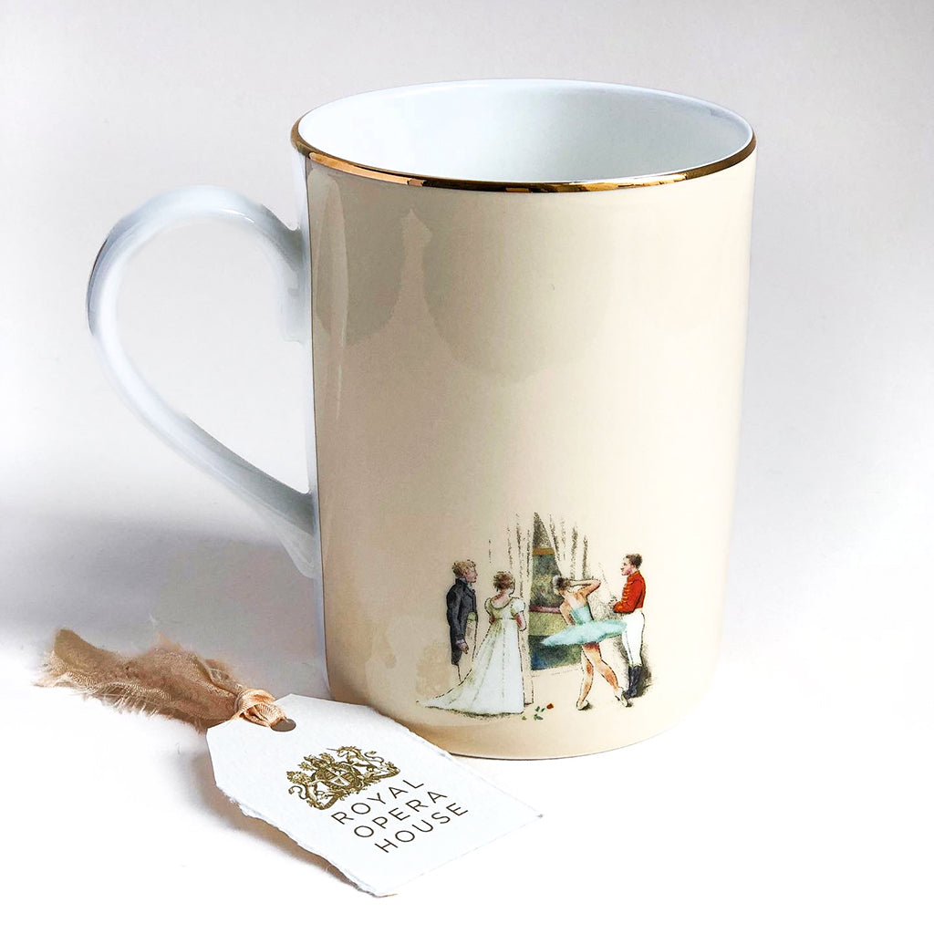 An Auditorium Mug against a white background. The mug has a painted design showing The Royal Opera House main stage's red curtains with gold decoration and the royal crest at the top. Above the curtain is a gold design arch, and the mug has a gold edge around the rim. On the right of the mug is a white handle. 