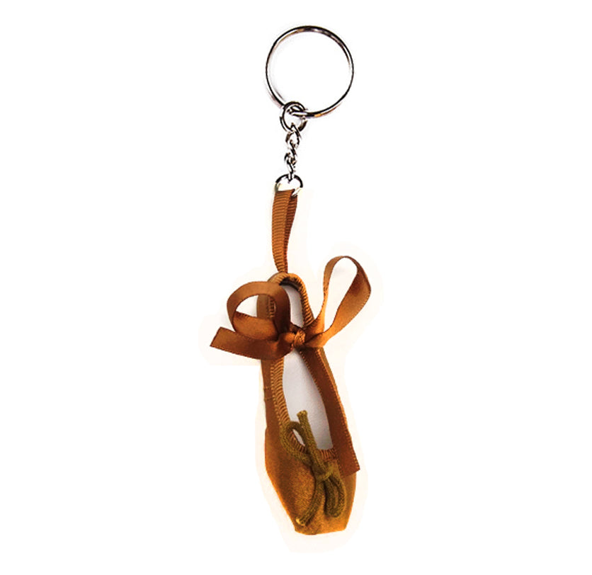 Bronze ballet shoe keyring with a ribbon on a white background