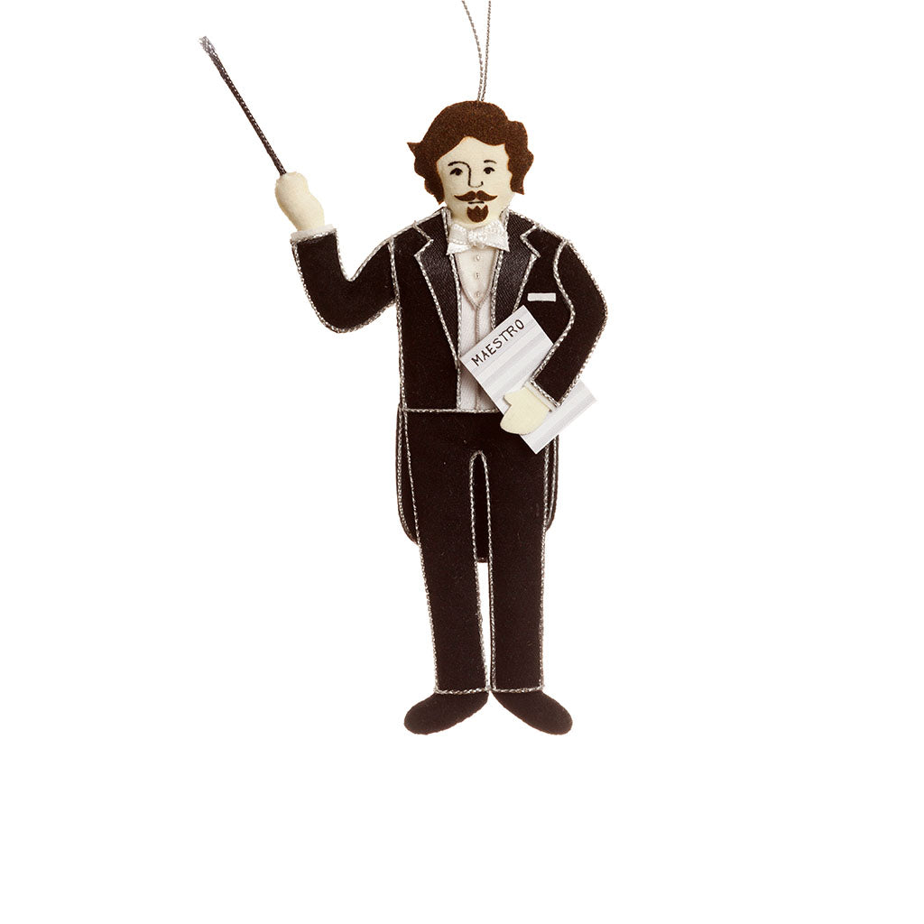 decoration featuring a maestro wearing a formal suit with a raised batton and sheet music on a white background